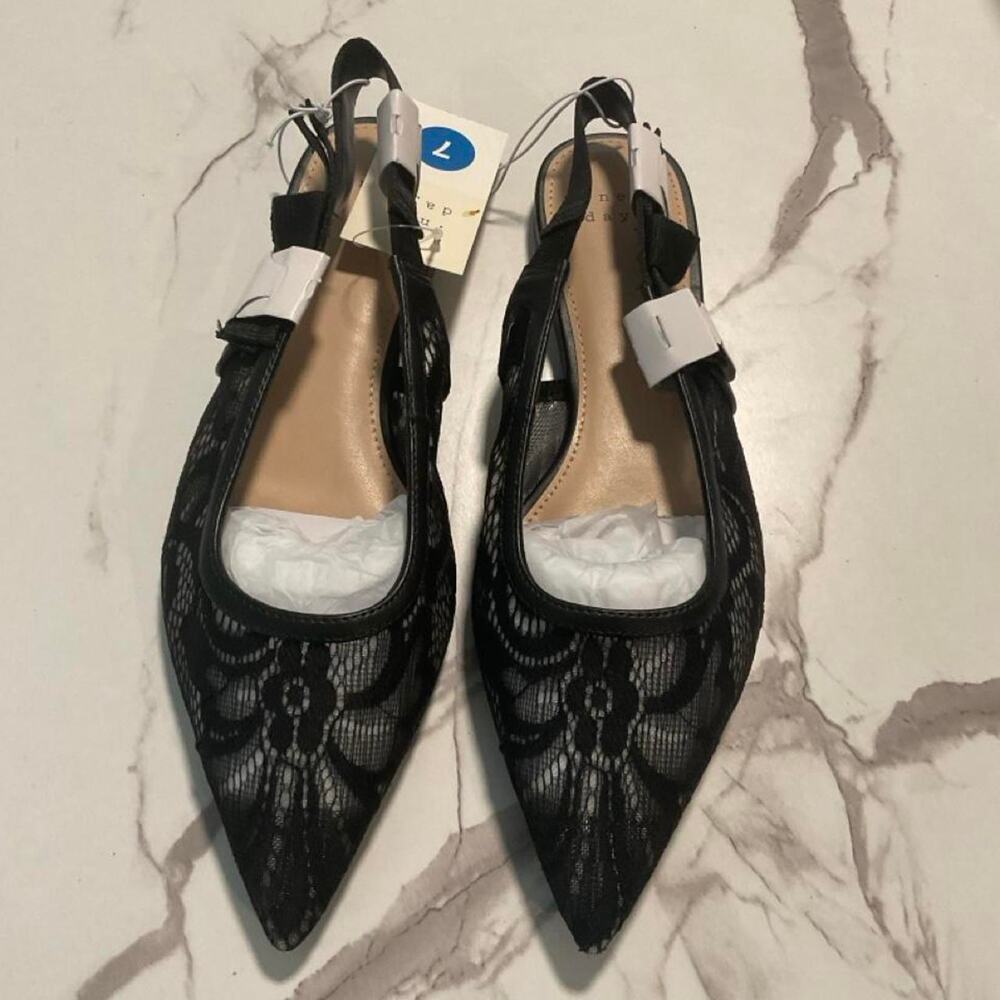 Black lace flats with snakeskin